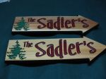Wood engraving arrows pointing to cottage